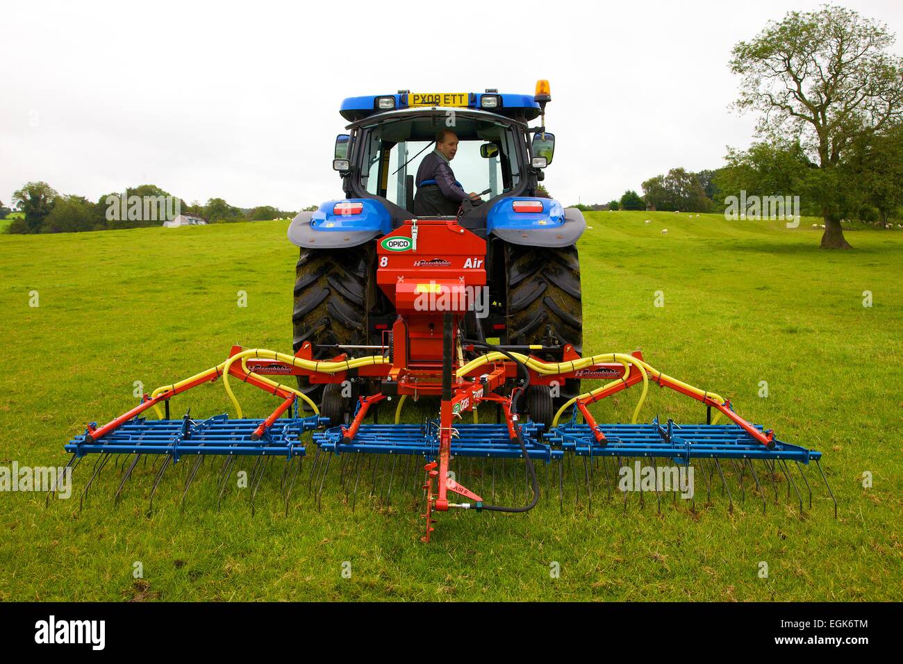 Hatzenbichler Air 8 Pneumatic Seeder & Tractor in field. Stock Photo