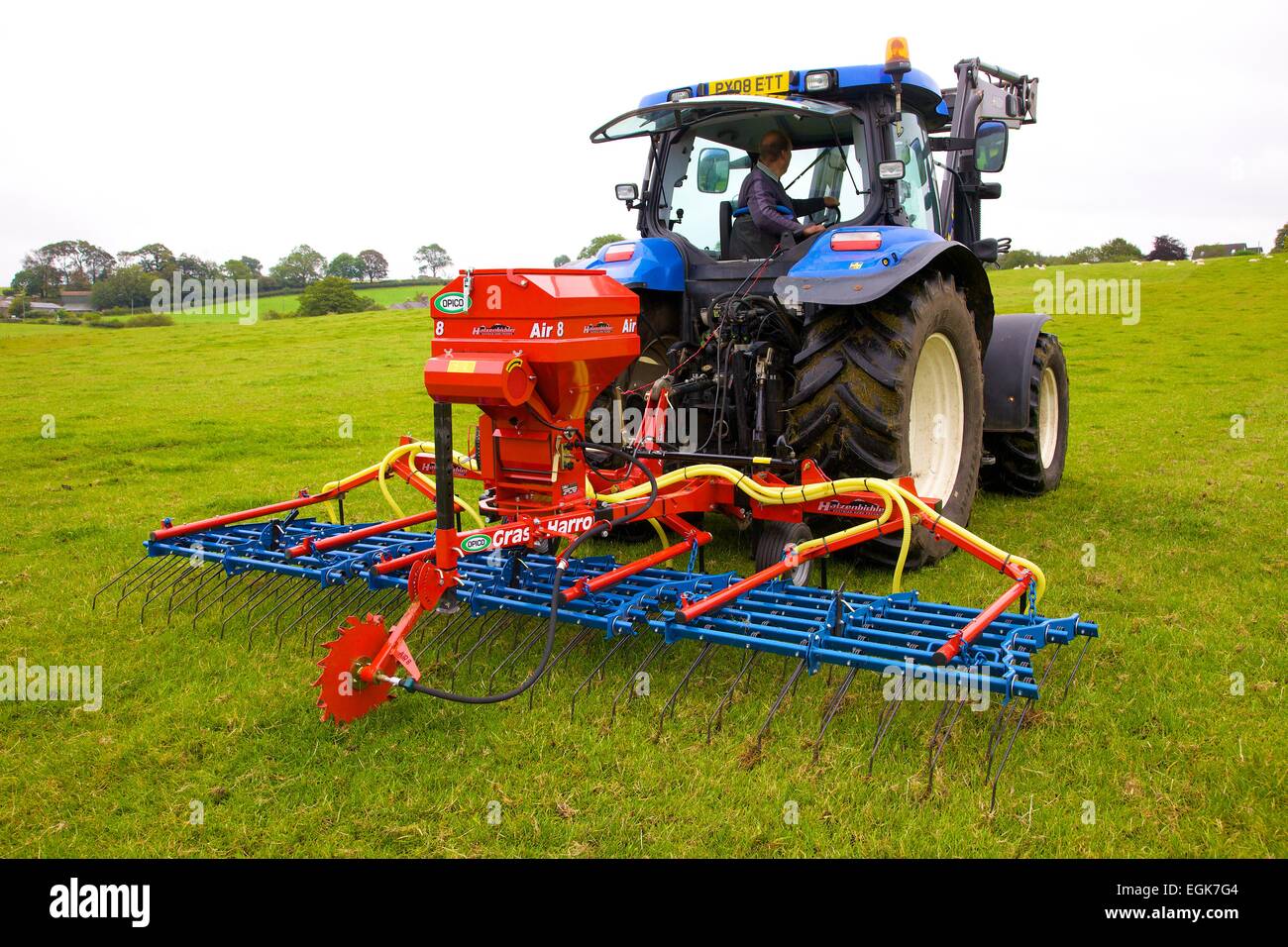 Hatzenbichler Air 8 Pneumatic Seeder & Tractor in field. Stock Photo