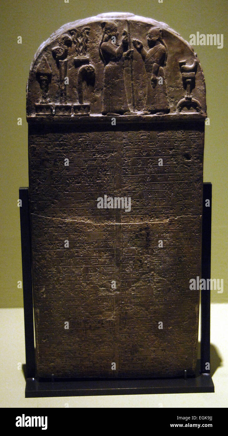 Kudurru (stele) of King Marduk-zakir-shumi (852-828 BC). An act of donation to a priest of the temple of Eana of Uruk. Mesopotamia. Limestone. Cuneiform. Babylon exposore. Louvre. Paris. Stock Photo