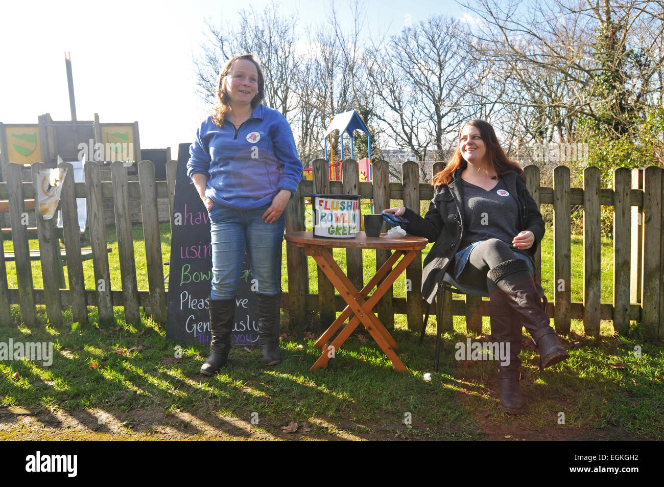 Two women take donations for a fete in a local park in Cornwall Stock Photo