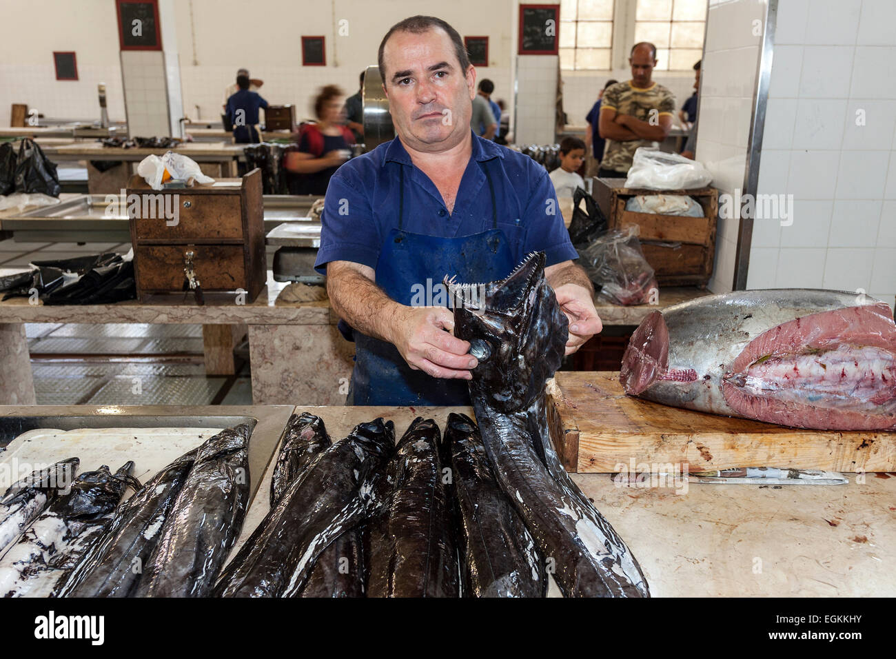 Fishmonger, black scabbard fish, fish market, Funchal, Madeira, Portugal Stock Photo