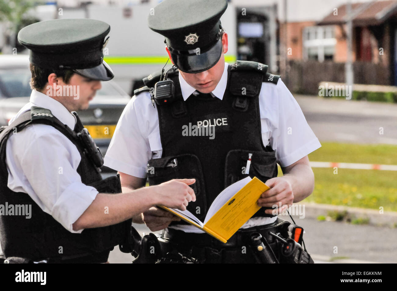 17th May 2013, Belfast, Northern Ireland.  A PSNI Officer examines a Serious Crime Scene Log Book (SCSLB), form 38/15, which records the movements of police and partner agencies as they arrive and leave at a serious crime scene.  This may later be used in court. Stock Photo