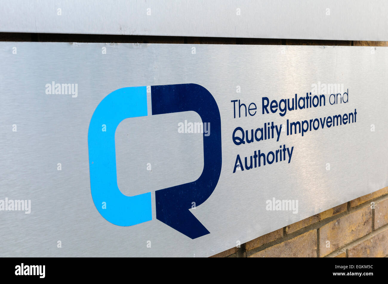 Sign outside the Regulation and Quality Improvement Authority (RQIA), responsible for regulating health and social care in Northern Ireland Stock Photo