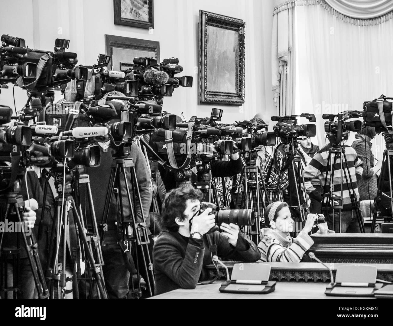Feb. 25, 2015 - Photographer press service of the Cabinet of Ministers of Ukraine Andrew Kravchenko (in front) photographs the during a meeting of the Cabinet. (Credit Image: © Igor Golovniov/ZUMA Wire) Stock Photo