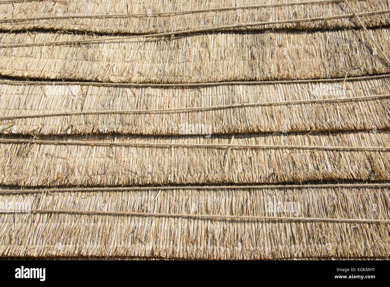 closeup of straw mat tied with thin rope Stock Photo