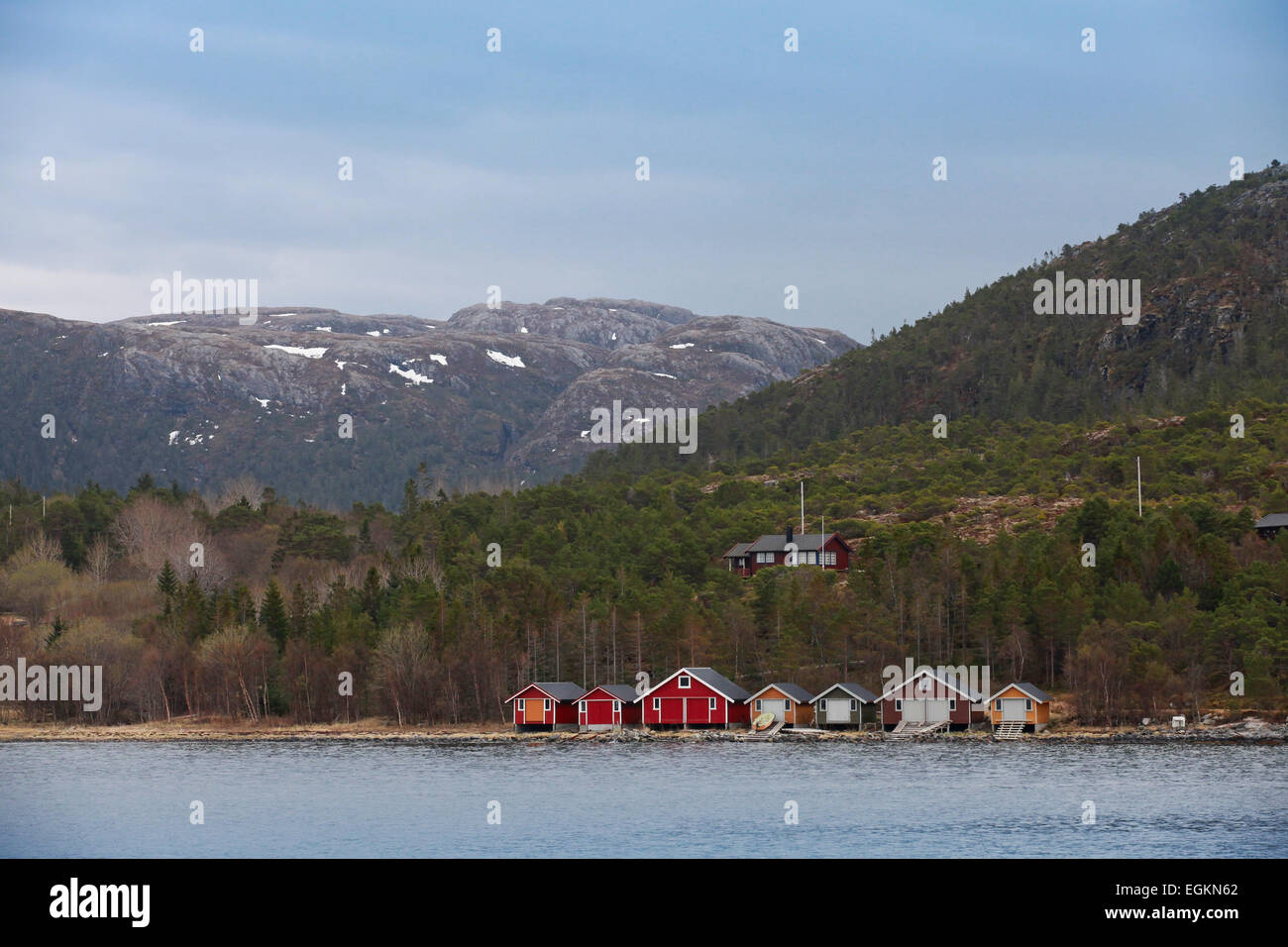 Traditional Norwegian small fishing village with colorful wooden houses on seacoast Stock Photo