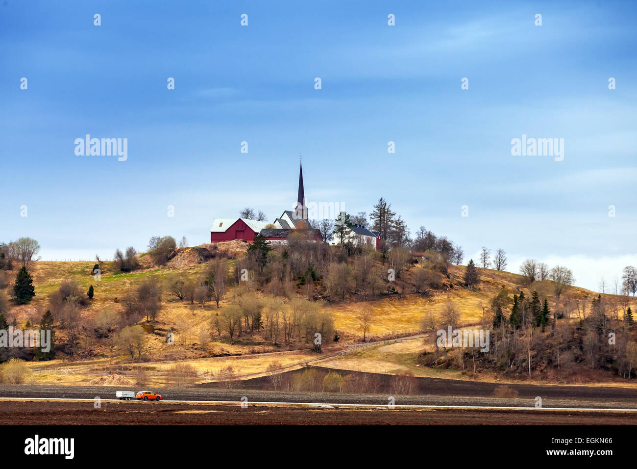 Traditional Norwegian Lutheran Church in small village on the hill Stock Photo