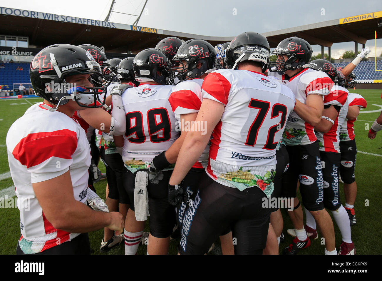 ST. POELTEN, AUSTRIA - JULY 26, 2014: The team of the Carinthian Lions stands in a huddle before Silver Bowl XVII. Stock Photo