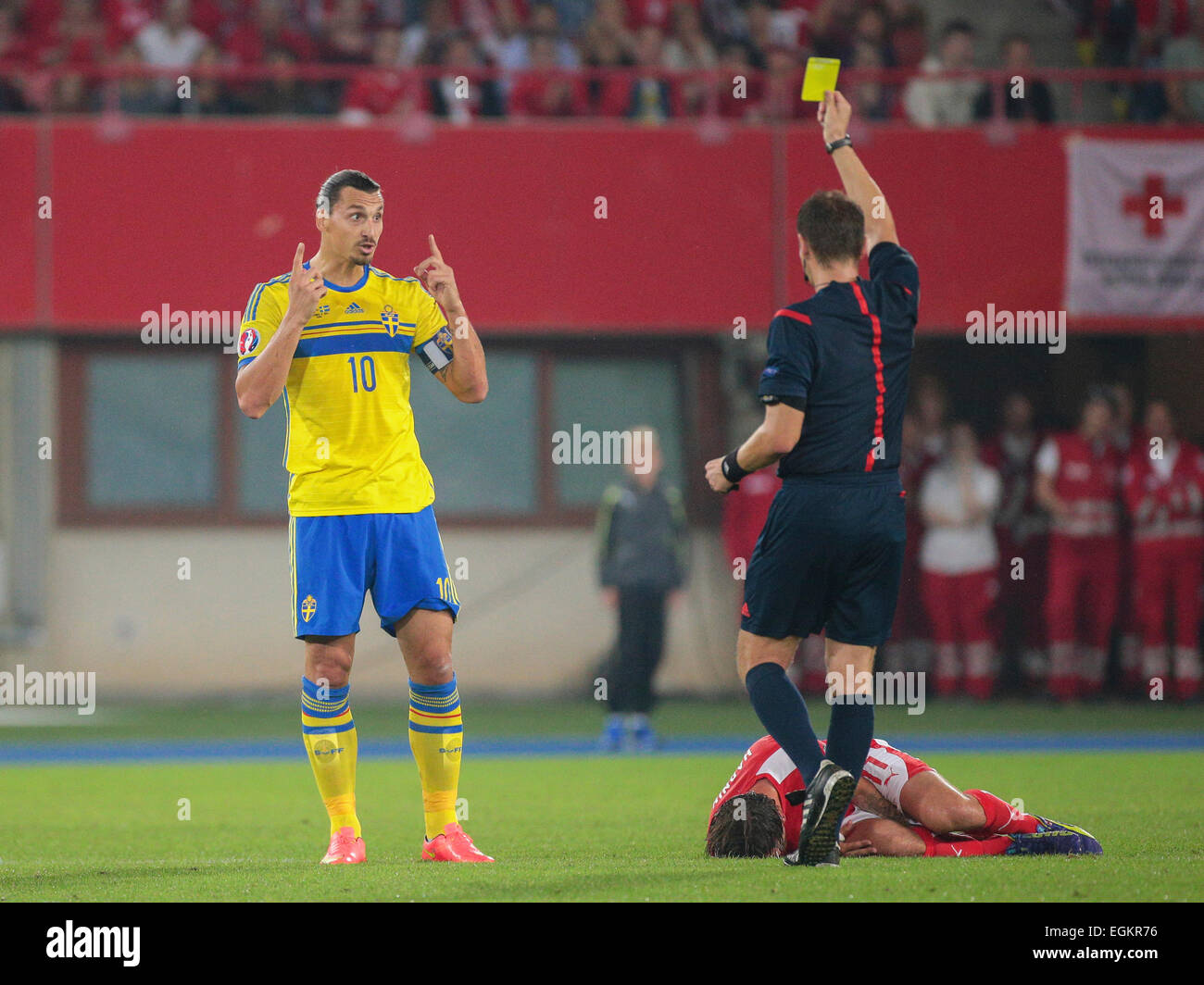 VIENNA, AUSTRIA - SEPTEMBER 9, 2014: Referee Pavel Kralovec (Czech Republic) shows the yellow card to Zlatan Ibrahimovic (#10 Sw Stock Photo