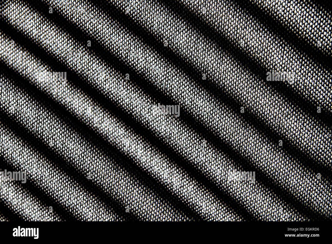 Shadow pattern from a venetian blind on a chair Stock Photo