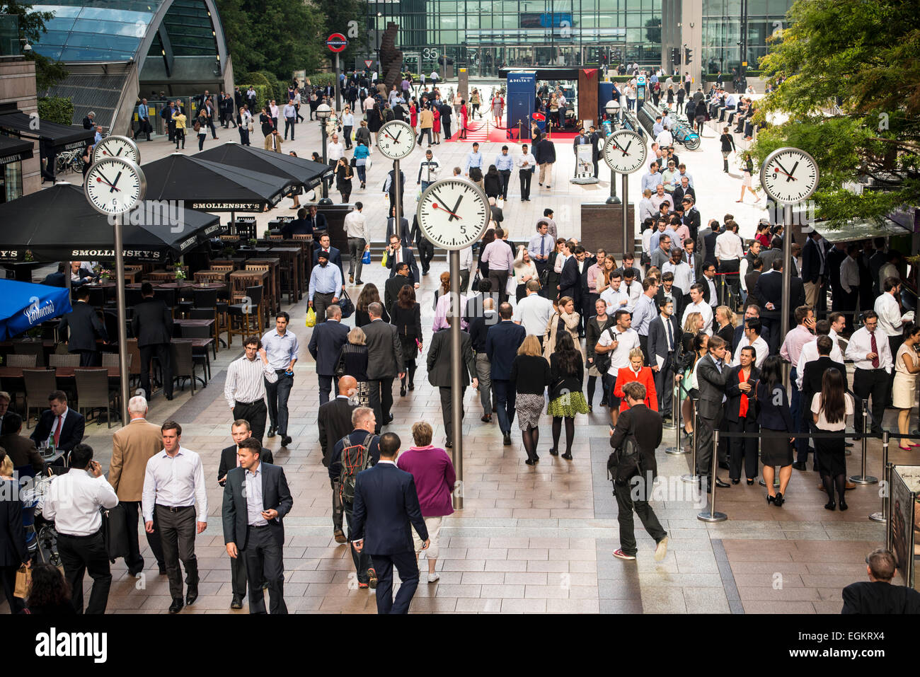 Busy Reuters Plaza at lunch time in Canary Wharf in London Stock Photo