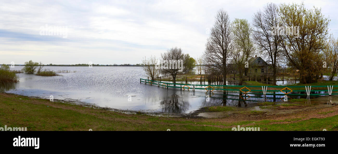 Spring panorama with the river in flood cloudy day Belarus Stock Photo