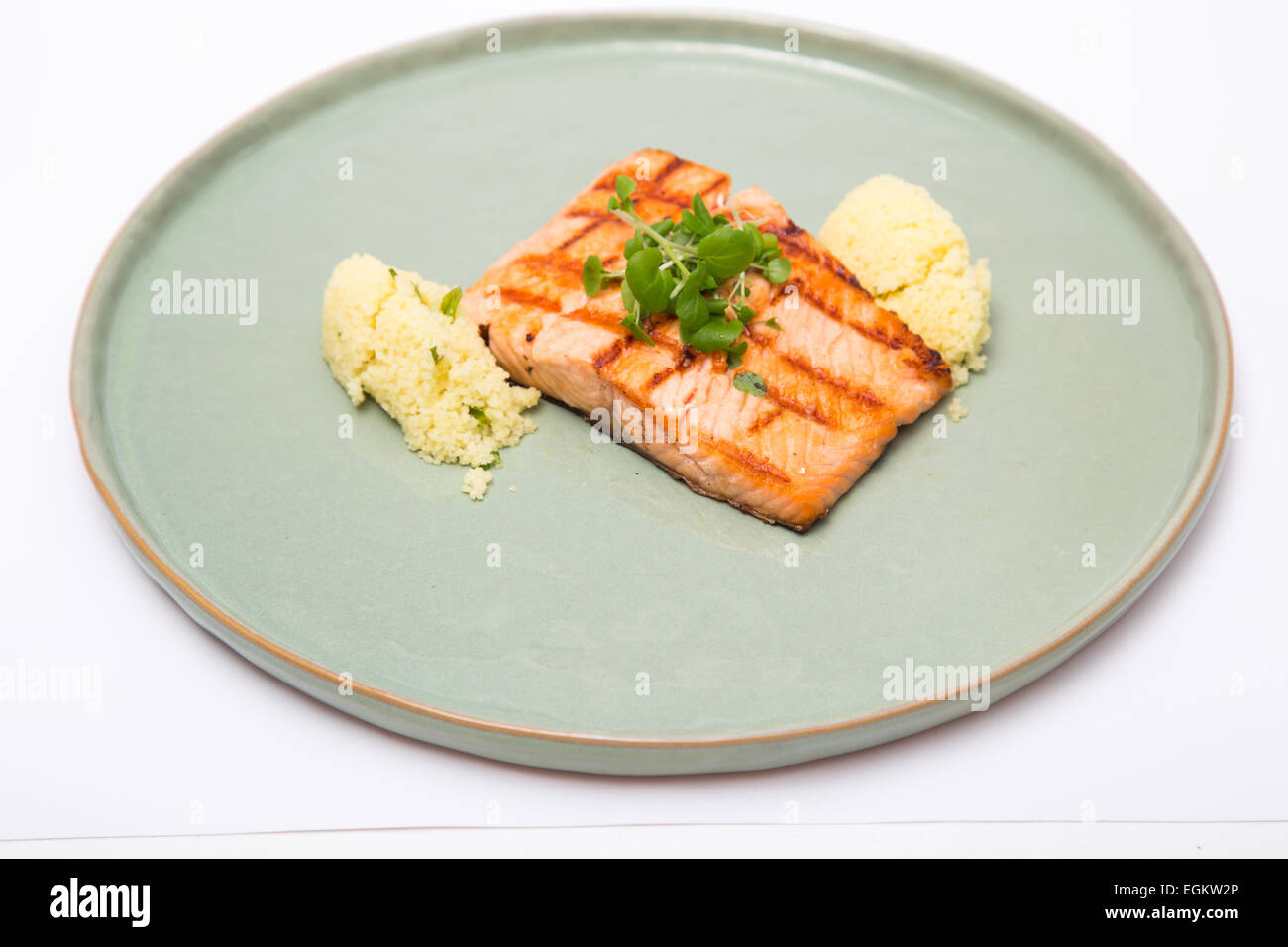 Grilled salmon fillet on a plate shot against white background Stock ...