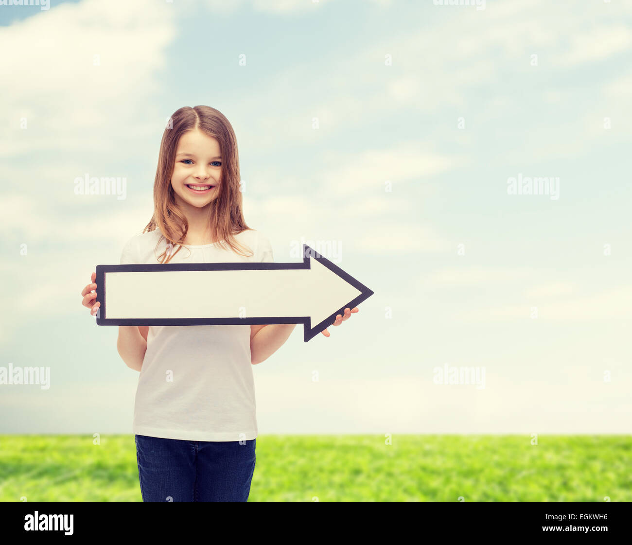 smiling girl with blank arrow pointing right Stock Photo - Alamy