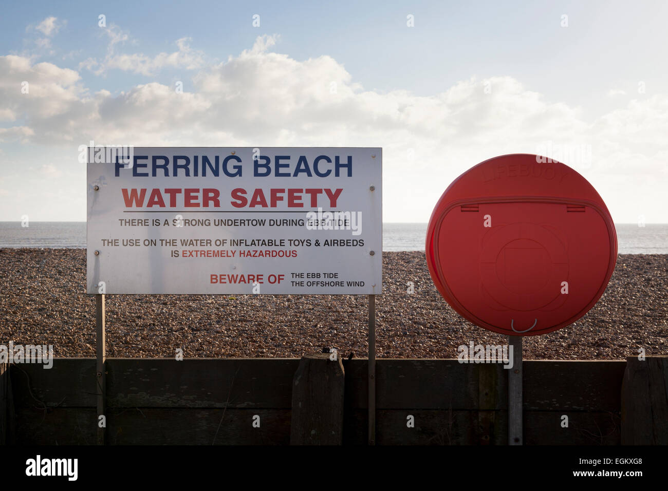 Ferring beach water safety sign and lifebuoy ring housing Stock Photo