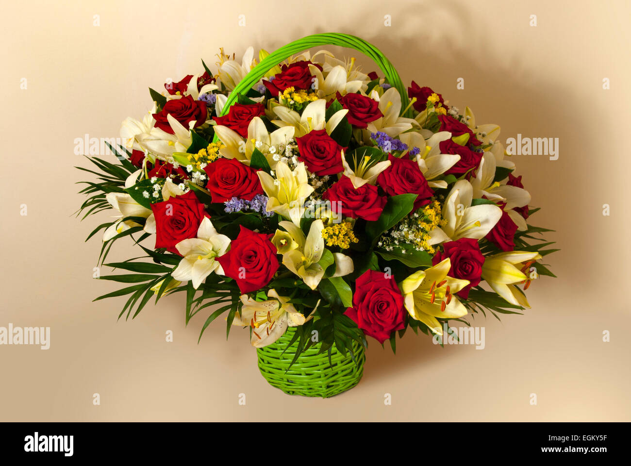 Still life with red roses and white lilies( Lilium candidum ),( Statice