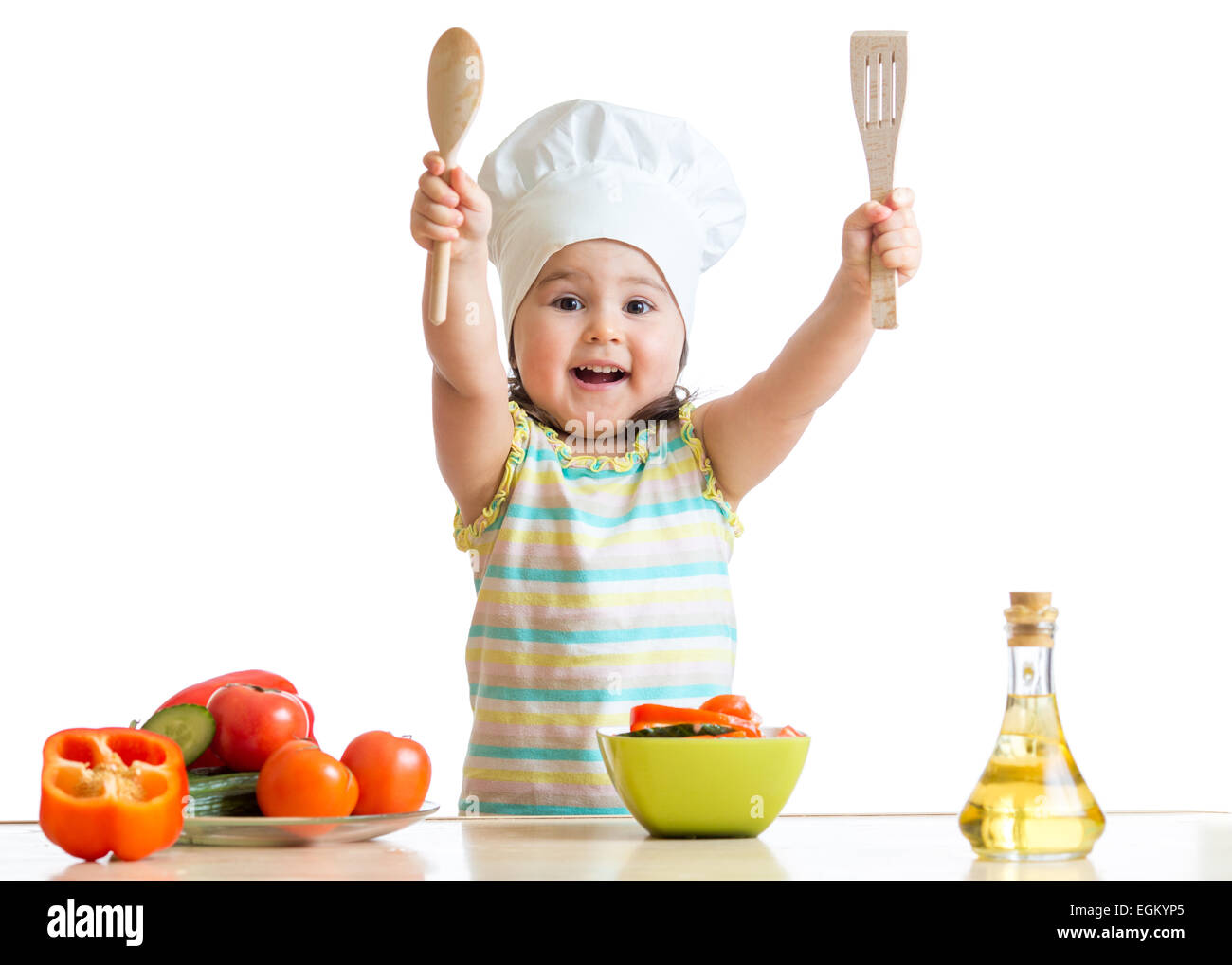 Smiling little cook with ladle, isolated on white Stock Photo