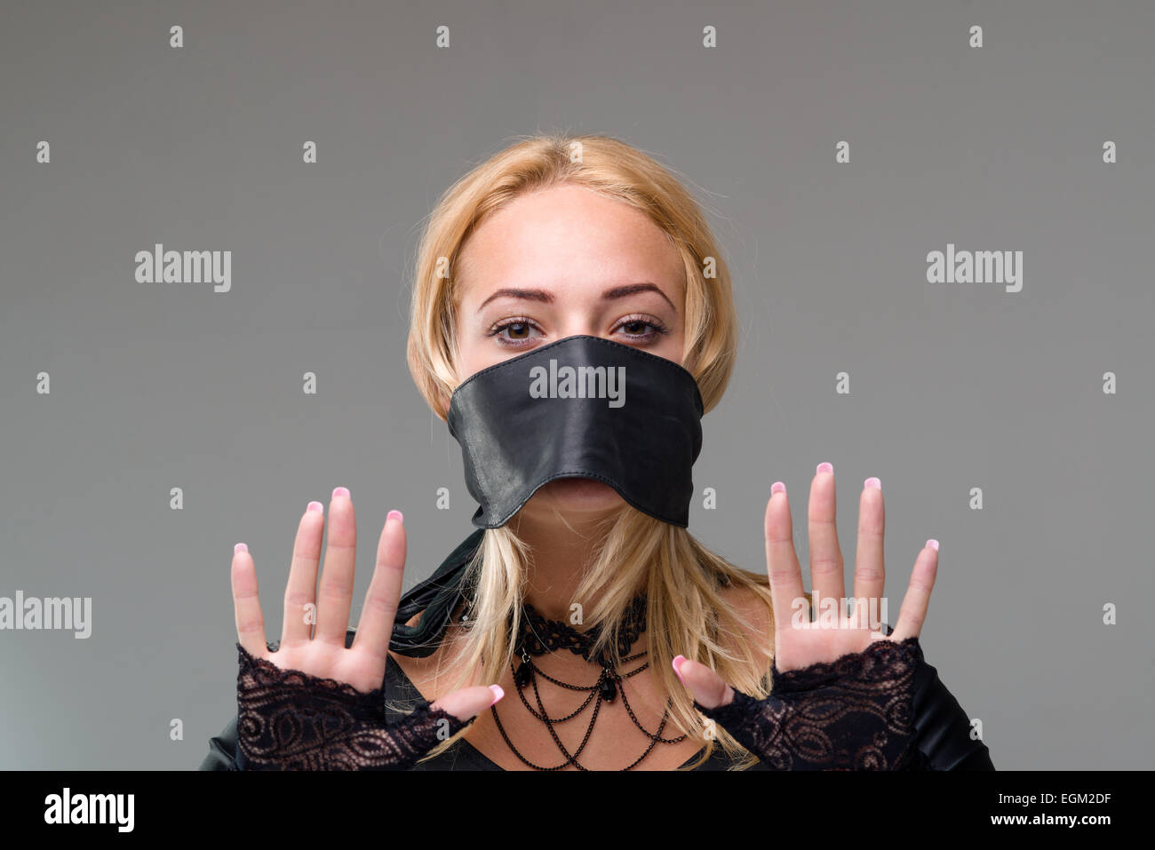 girl with selfadhesive tape over her mouth on gray Stock Photo Alamy