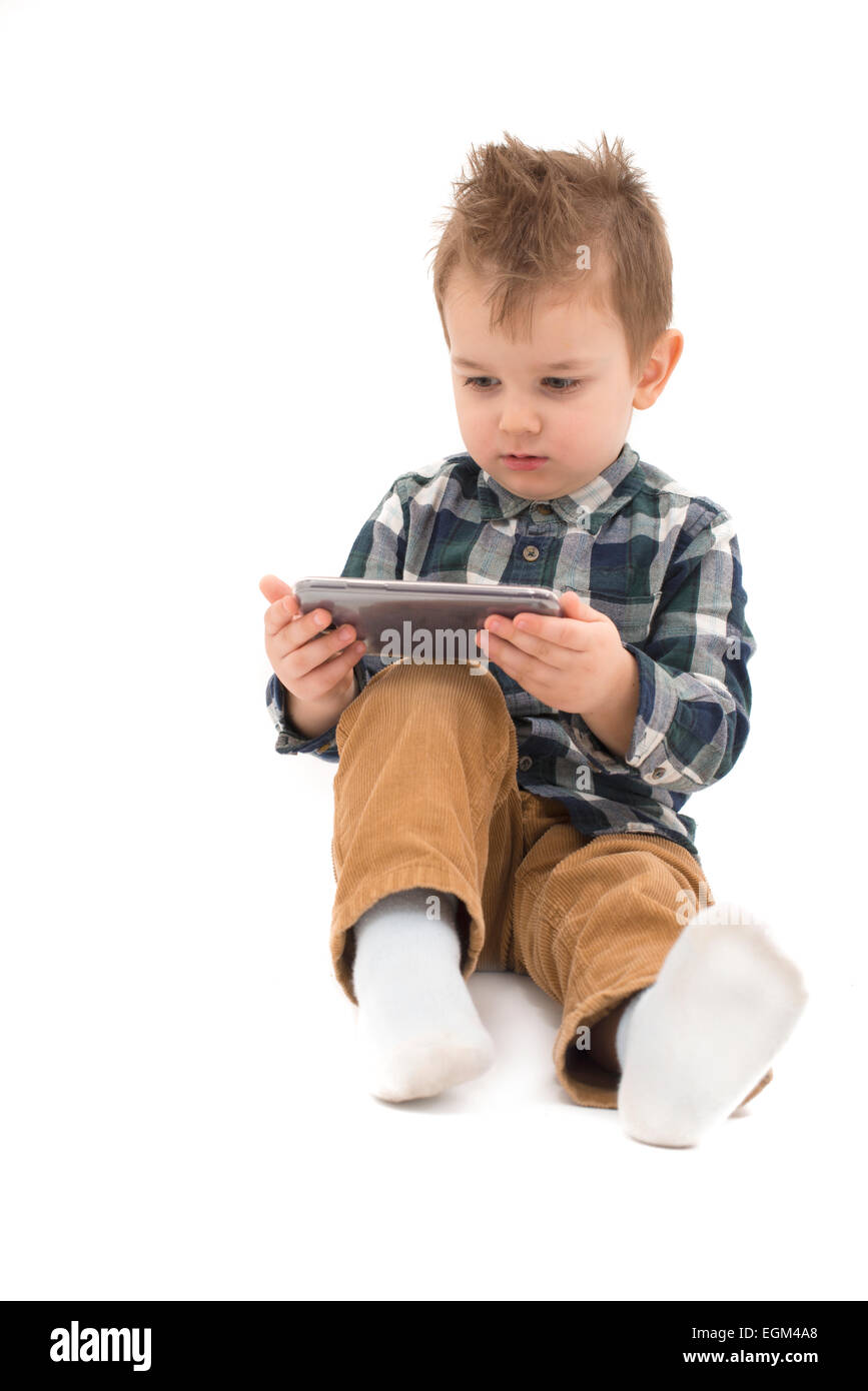 Little boy watching cartoons on cell phone Stock Photo