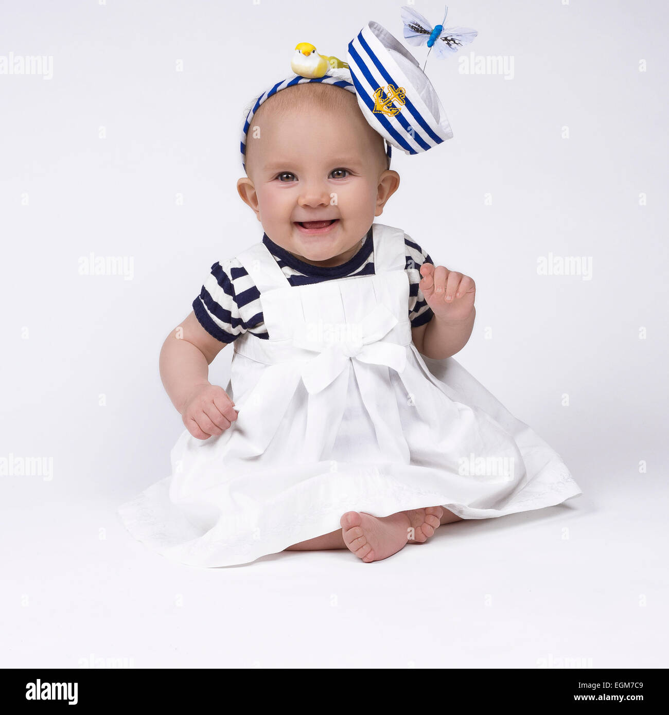 beautiful baby girl wearing a sailor outfit and smiling Stock Photo - Alamy