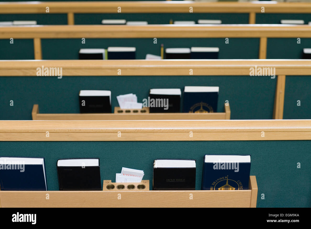 Church Pews with Bibles and Hymnals Stock Photo