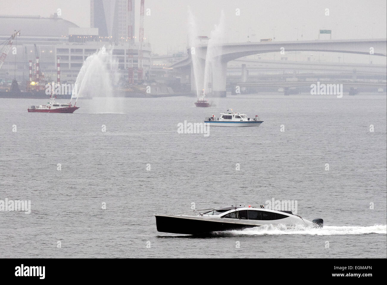 The Duke of Cambridge arrives in Tokyo by boat on February 26th, 2015. The Prince flew in to Tokyo International Airport on Thursday afternoon and then traveled to Tokyo city on a cruise boat to visit the historic Hama Rikyu gardens and a traditional Japanese tea house. He arrived on a rainy day but nevertheless Japanese TV crews were out to try to catch a glimpse of the Prince as his boat entered Tokyo Harbour and passed under the Rainbow Bridge. On his visit he will launch an Innovation is Great campaign and also travel to Ishinomaki in Miyagi Prefecture to meet people who were affected by t Stock Photo