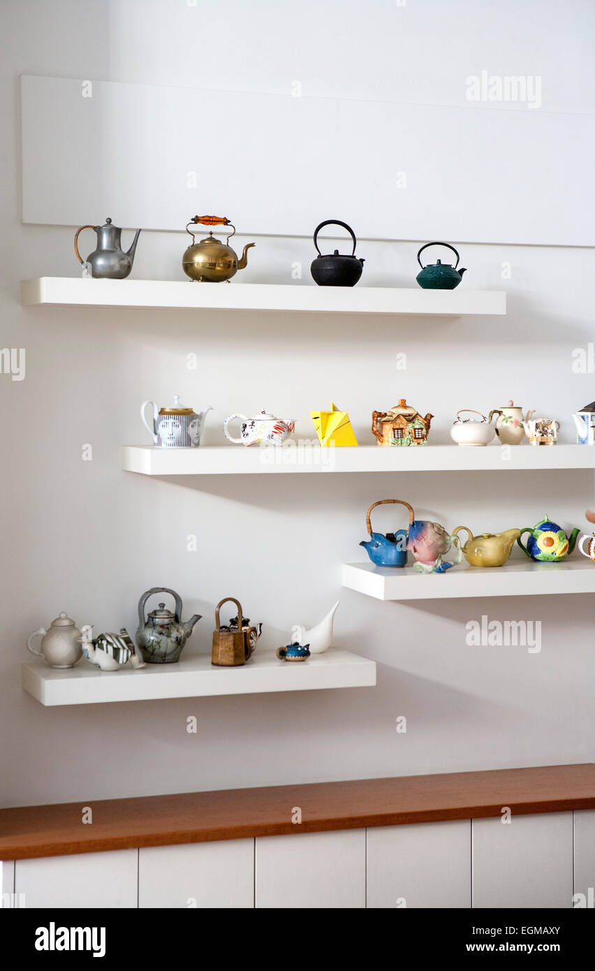Collections of Teapots on Wall Shelves Stock Photo Alamy