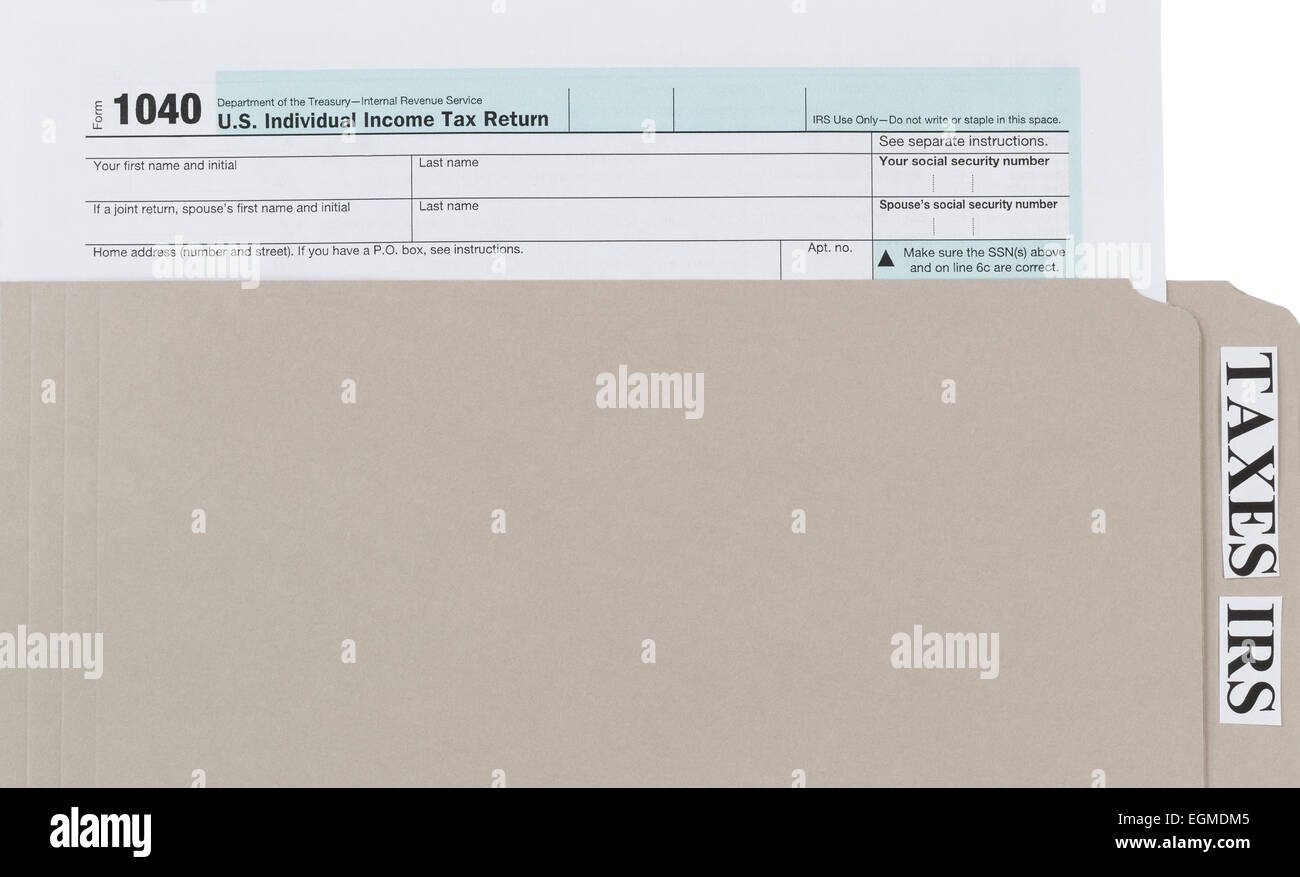 Individual tax form inside of gray folder. Business financial