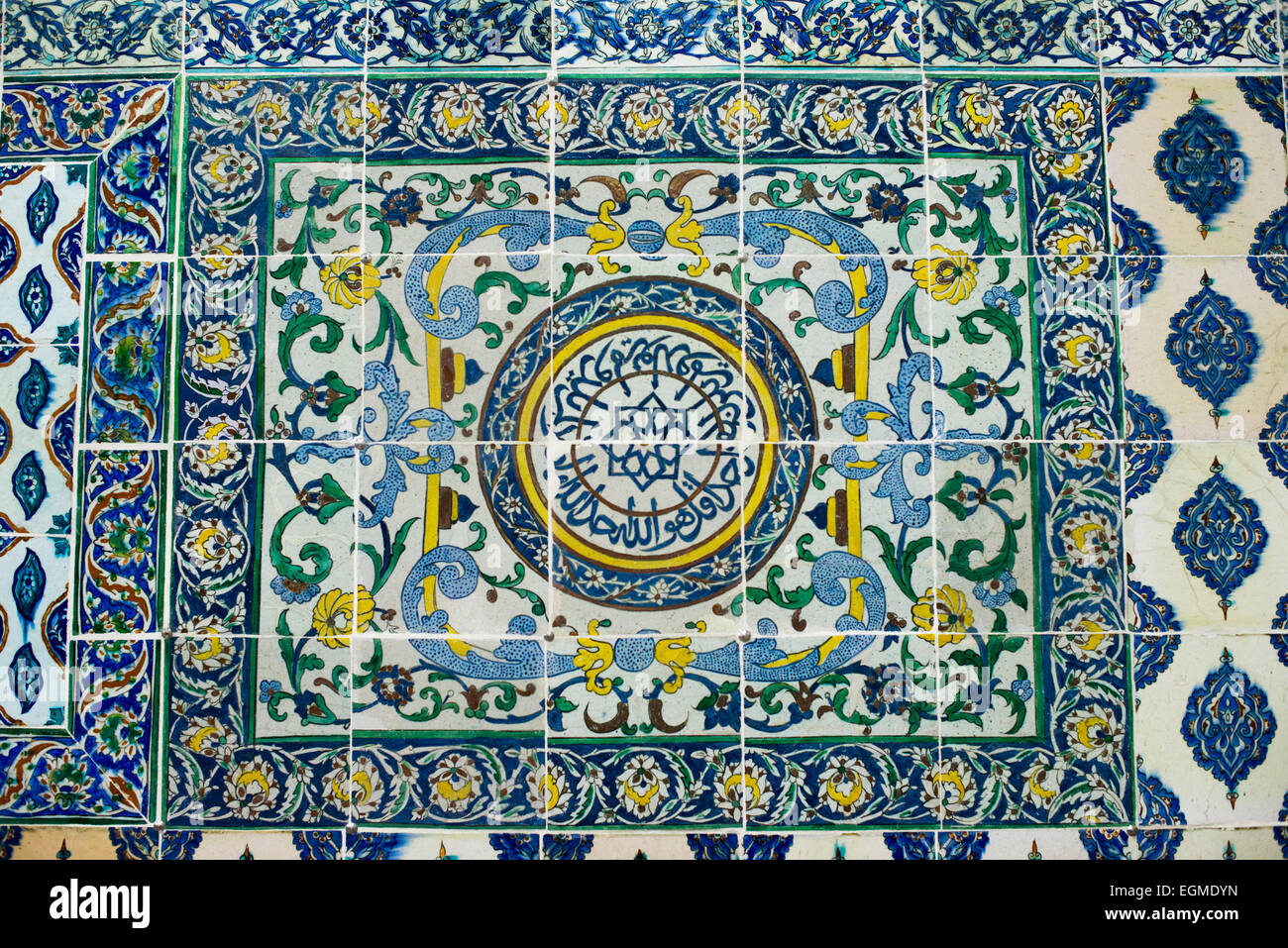 ISTANBUL, Turkey (Türkiye) — Ornate tiles decorating the walls of the Harem Mosque at Topkapi Palace. The Harem Mosque (Harem Mescidi) of Topkapi Palace was built in the 17th century as a prayer hall for the sultan's mother, daughters, and first consort, as well as senior women of the harem. The Imperial Harem was the inner sanctum of the Topkapi Palace where the Sultan and his family lived. Standing on a peninsular overlooking the Bosphorus Strait and Golden Horn, Topkapi Palace was the primary residence of the Ottoman sultans for approximately 400 years (1465–1856) of their 624-year reign. Stock Photo