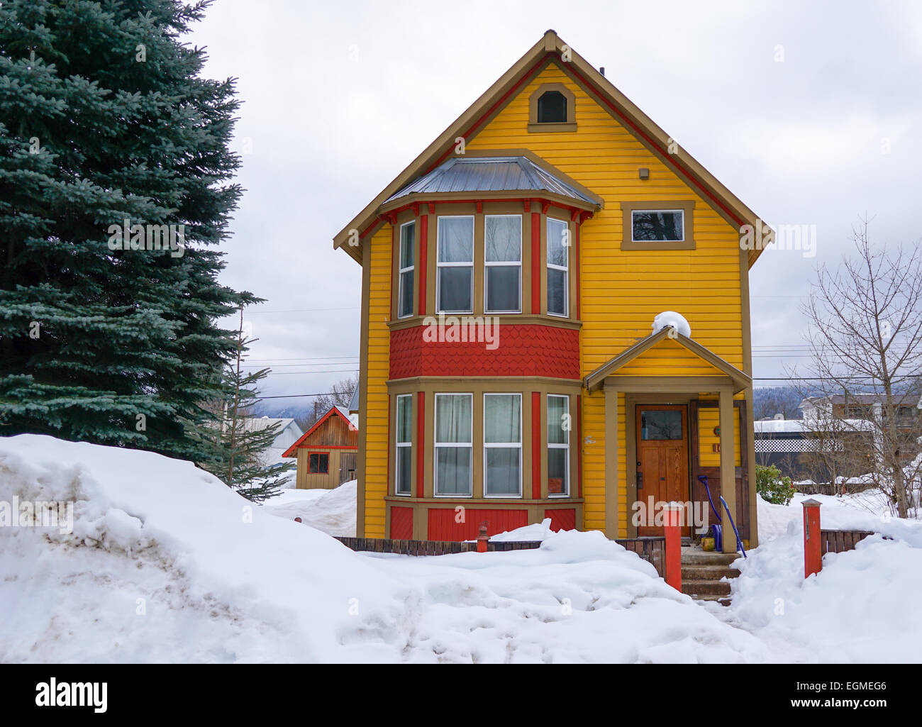 Colorful house in the snow, Revelstoke, Canada. Stock Photo