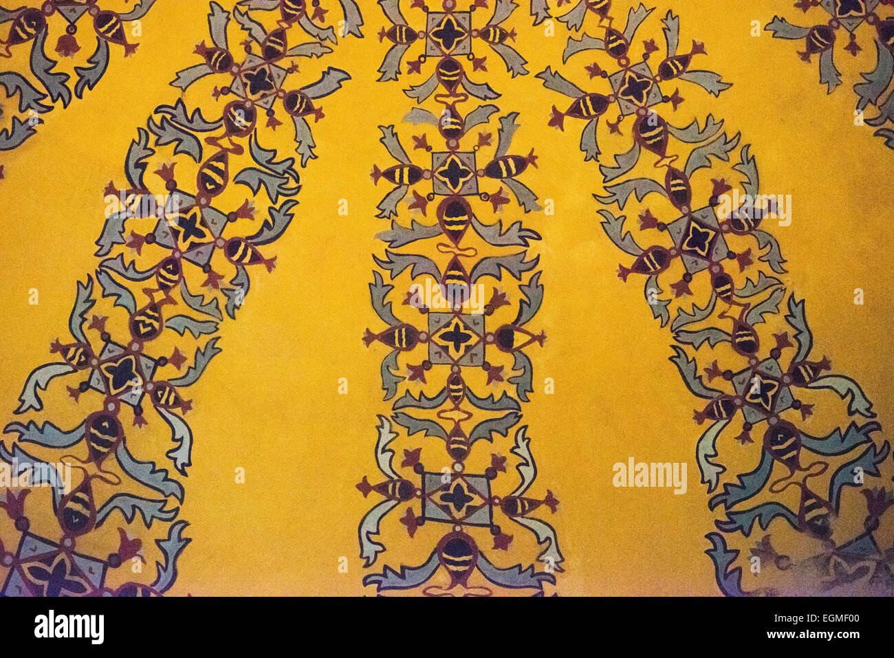 Hagia Sophia Cupola Ottoman Decoration Istanbul Turkey // ISTANBUL, Turkey — Ornate painted patterns adorn one of Hagia Sophia's cupolas, demonstrating Ottoman decorative traditions. These architectural embellishments were added during the building's use as a mosque. The geometric and floral designs reflect characteristic elements of Islamic architectural decoration. Stock Photo