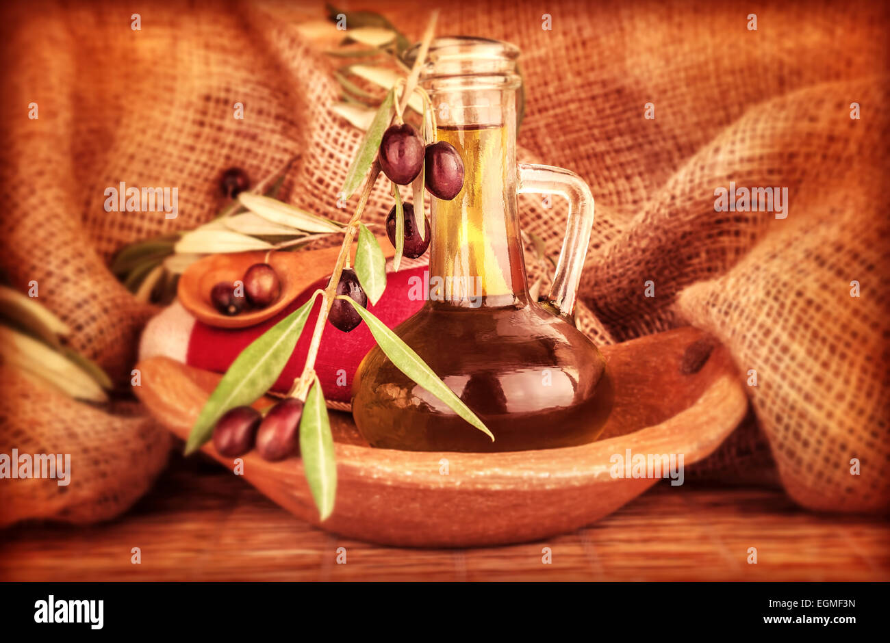 Extra virgin olive oil in the bottle decorated with fresh ripe olive ...