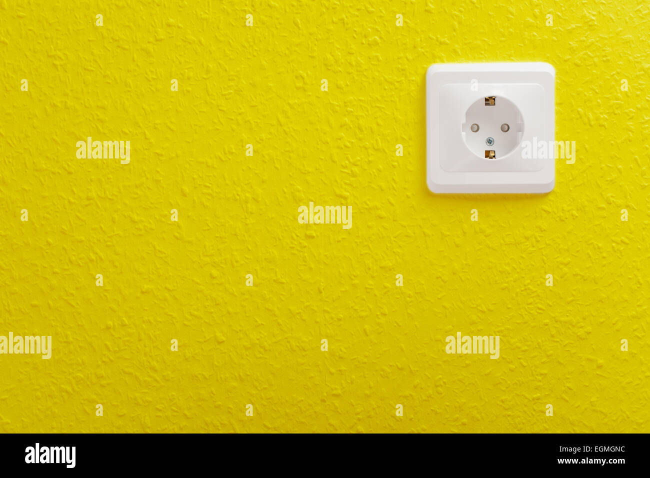 Single electric socket with plug on wall Stock Photo Alamy