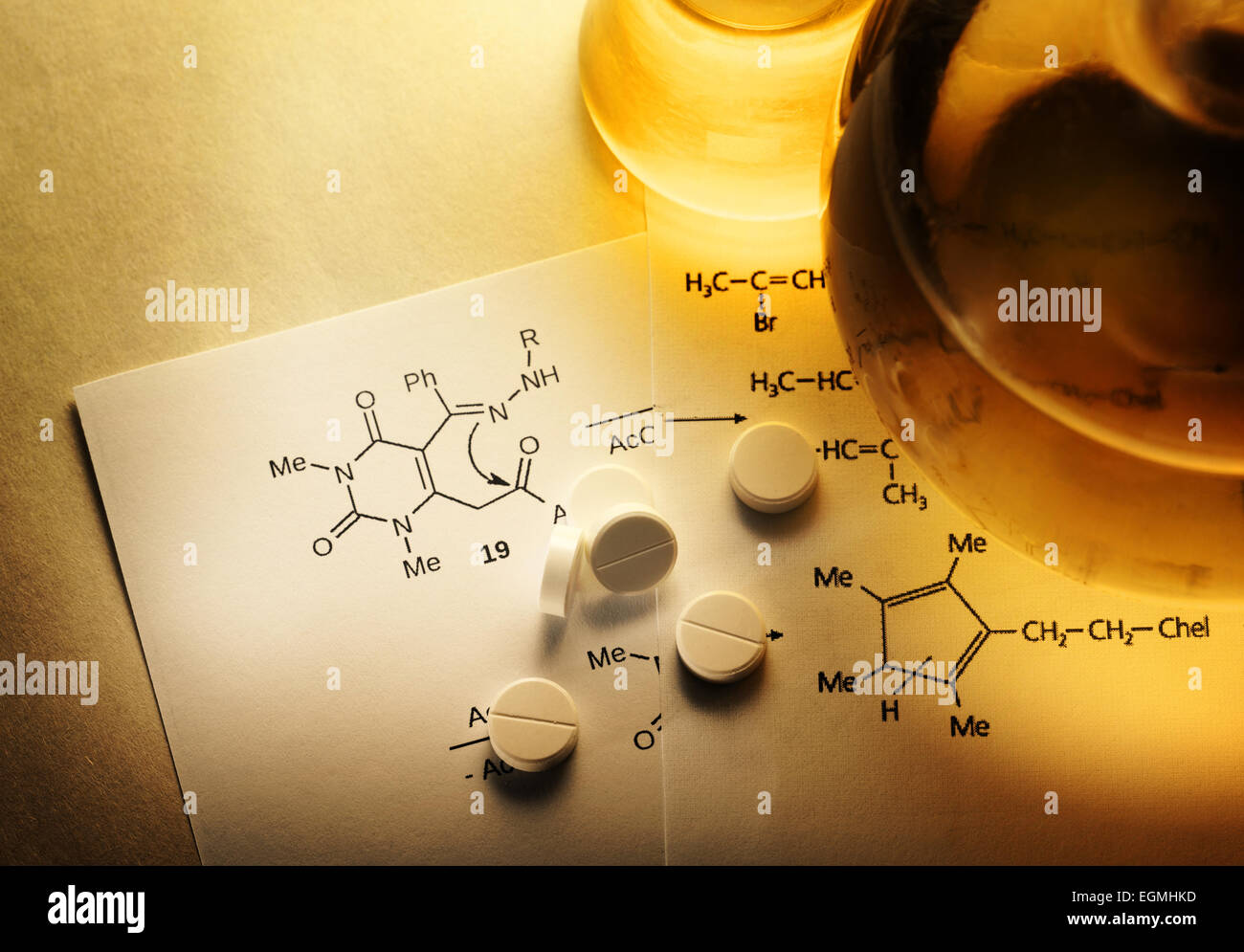 Chemistry reaction formula with white pills in closeup Stock Photo