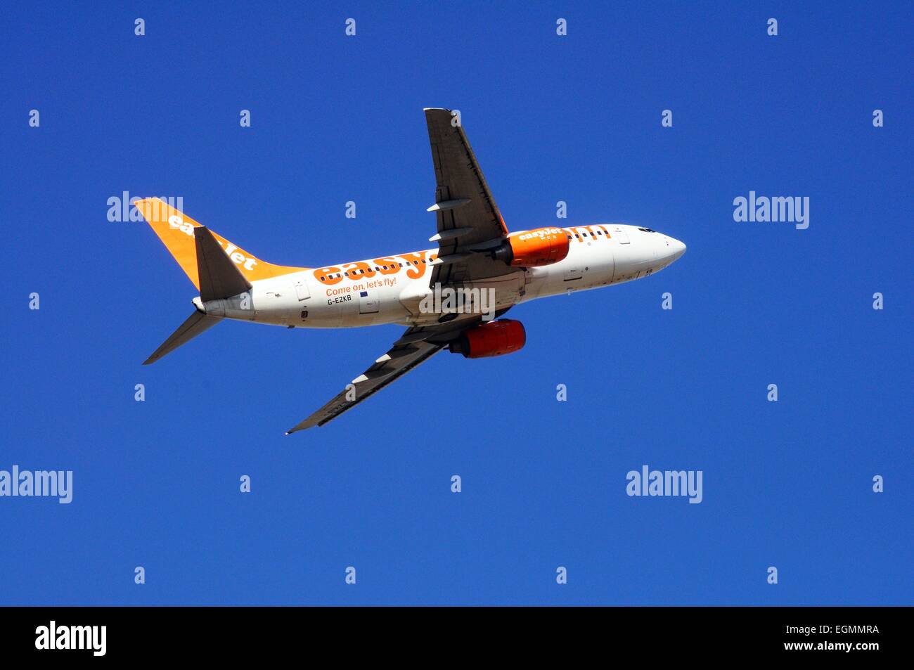 Easyjet Boeing 737-700 taking off against a blue sky. Stock Photo