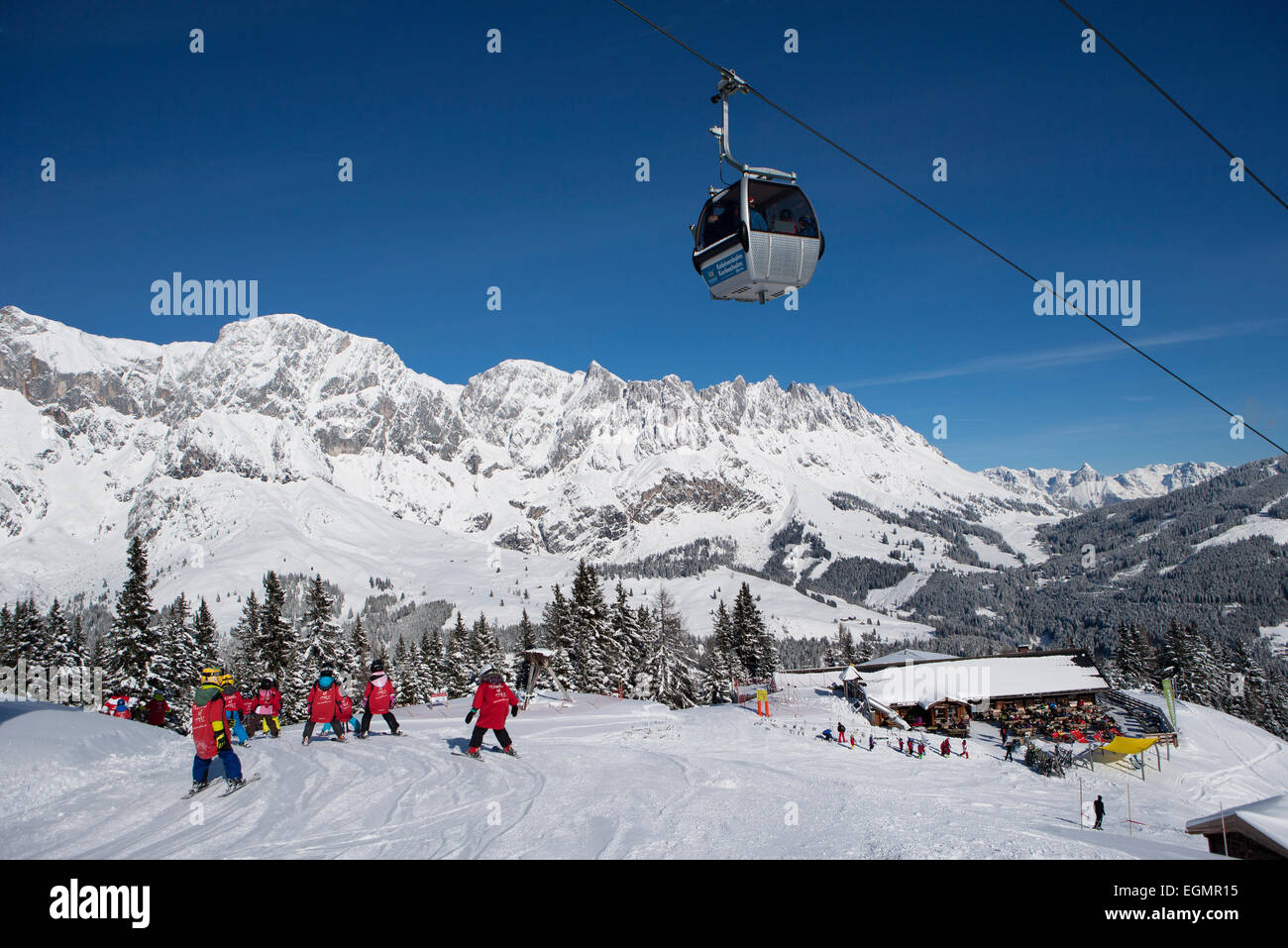 Skiers on ski slope in front of mountain scenery, Hochkönig, Karbachalm ropeway, ski resort Ski Amade, Mühlbach Stock Photo