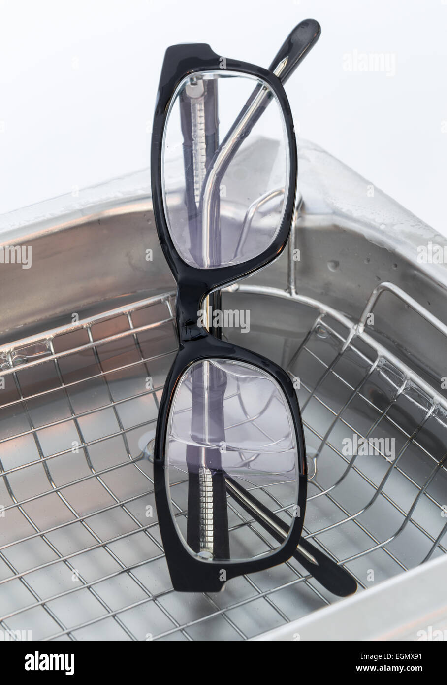 Professional cleaning glasses with an ultrasonic cleaner Stock Photo