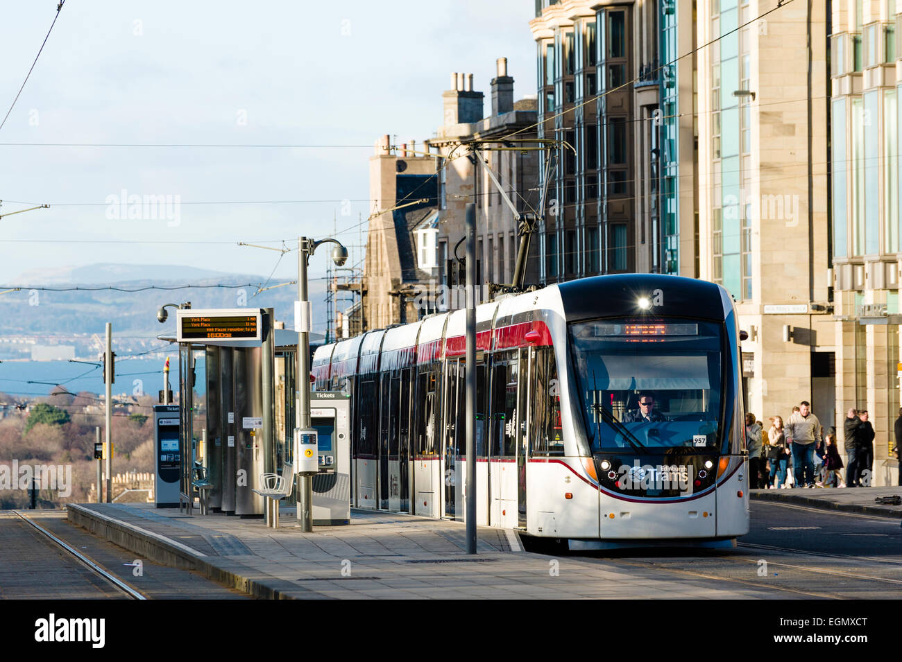 Airport-bound tram waiting at the platform in St Andrew Square, in central Edinburgh. Stock Photo