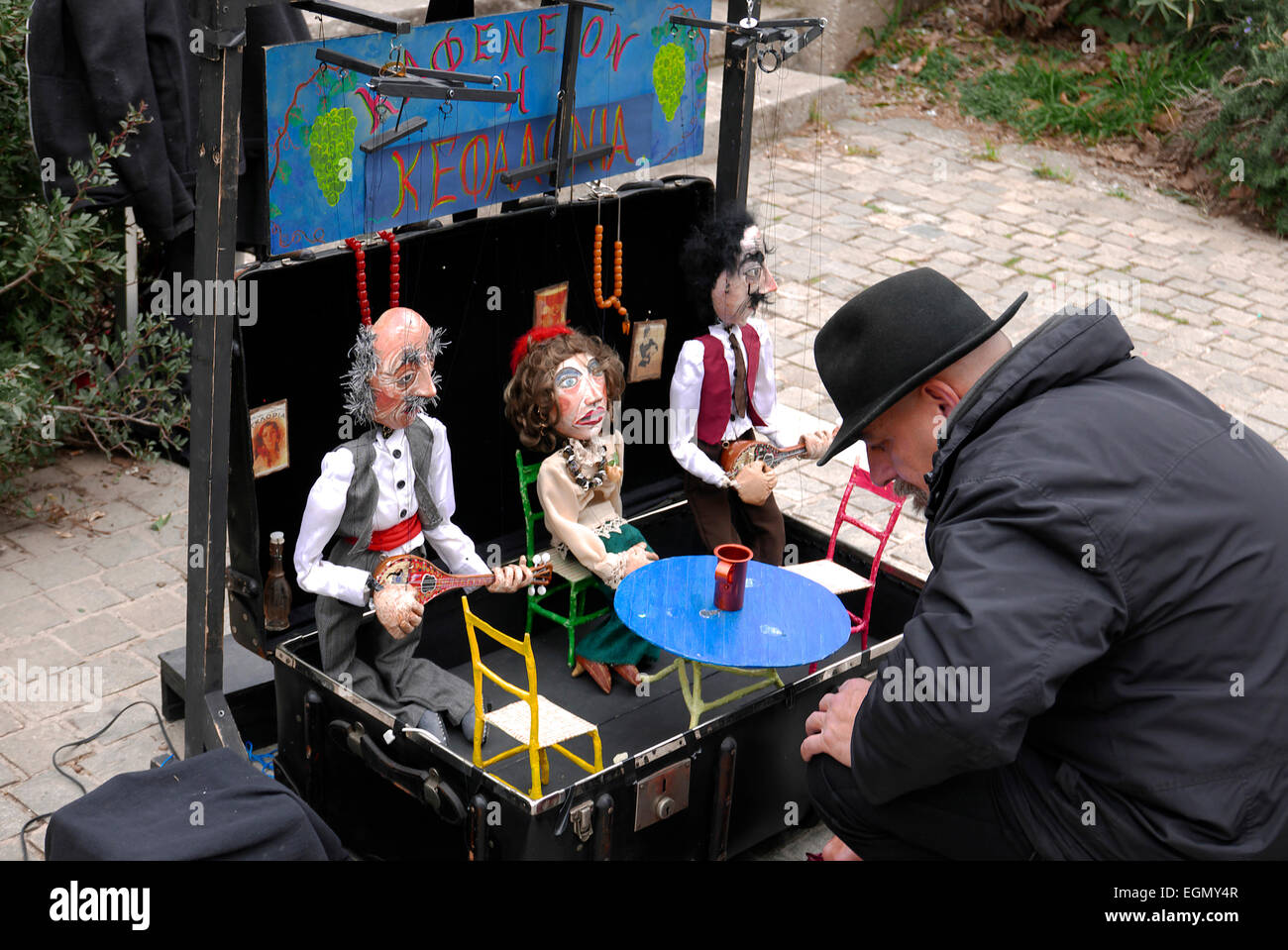 greece attica athens plaka a street performer setting up puppets Stock Photo