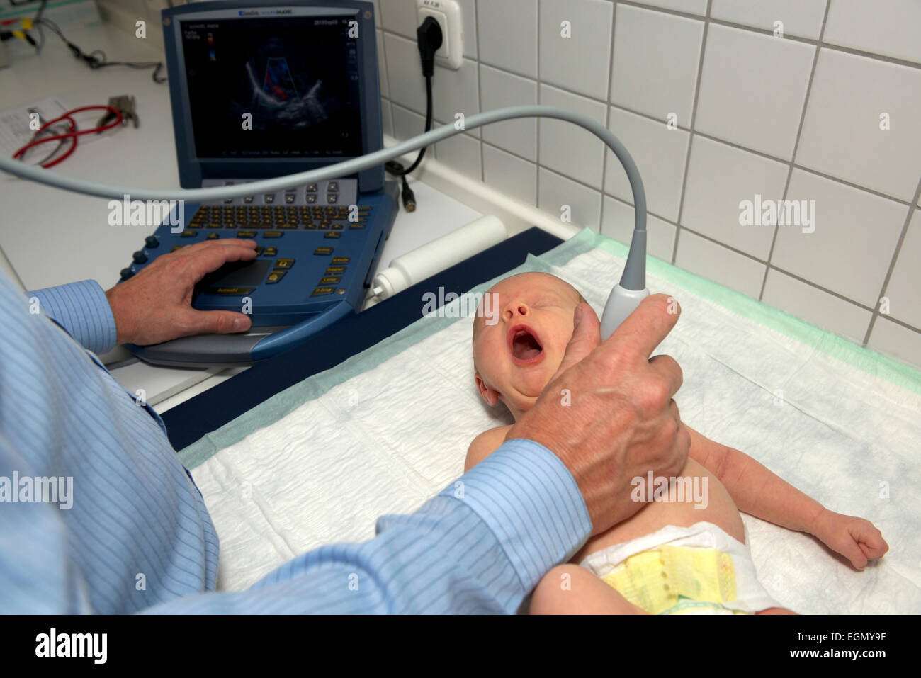 Baby undergoing ultrasonography Stock Photo