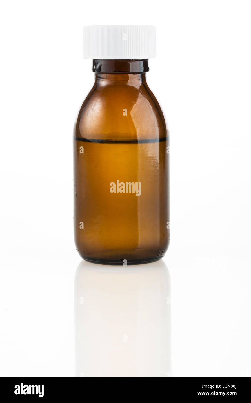 Brown medicine bottle with liquid inside and white top. Stock Photo