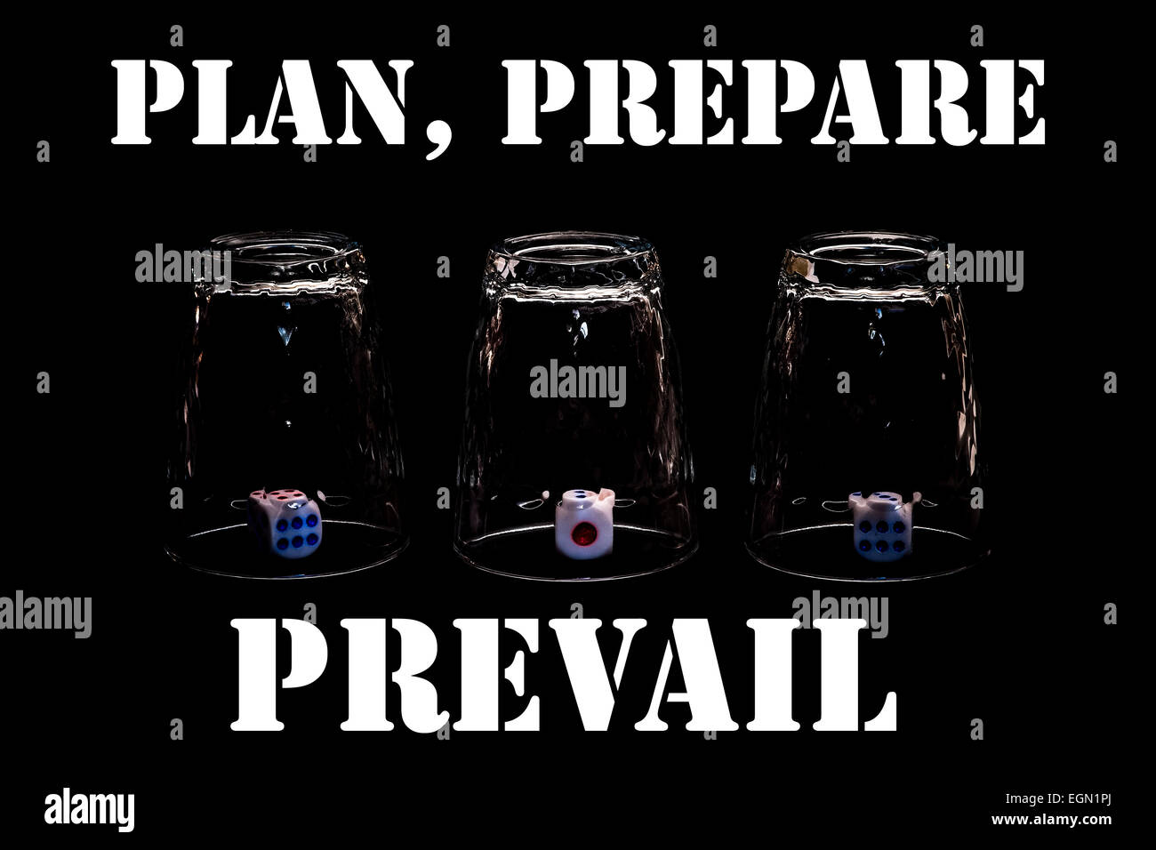 Closeup view of three overturned shot glasses with dices, tiles or dies inside each glass. Plan, prepare, prevail! Stock Photo