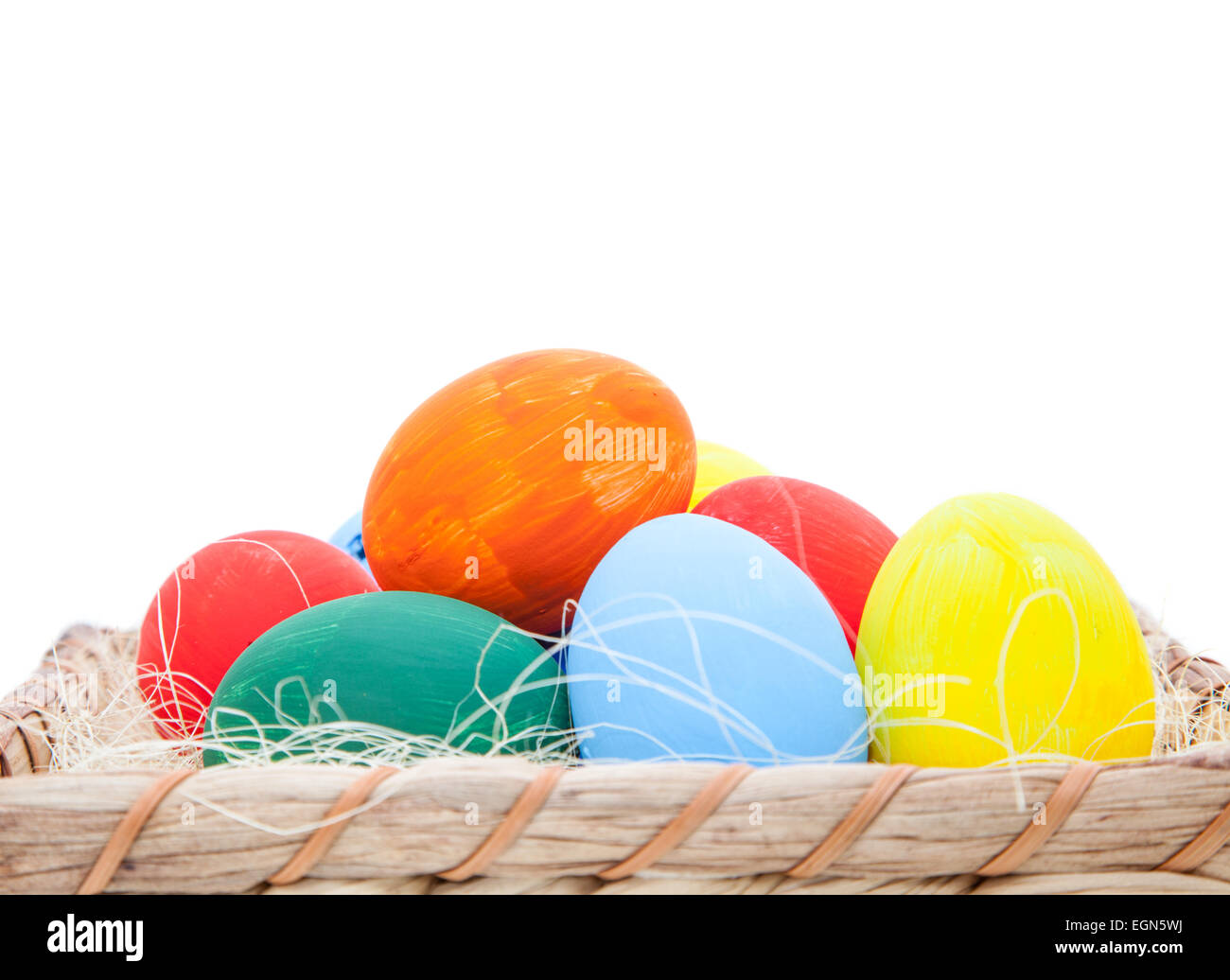 Colorful easter eggs in basket. All on white background Stock Photo - Alamy