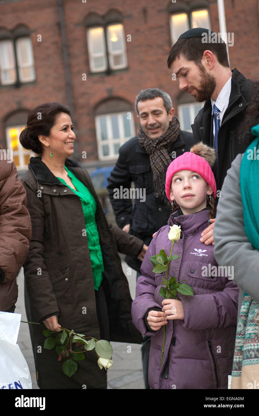 Copenhagen, Denmark. 27th February, 2015. Rabbi at Copenhagen synagogue, Jair Melchior (photo, right) participated in the rally against hate crimes and religious intolerance. Here he speaks with Dan Asmussen, Chair of Danish Association of Jews, and Mrs. Ozlem Zekem, Socialist People’s. Credit:  OJPHOTOS/Alamy Live News Stock Photo