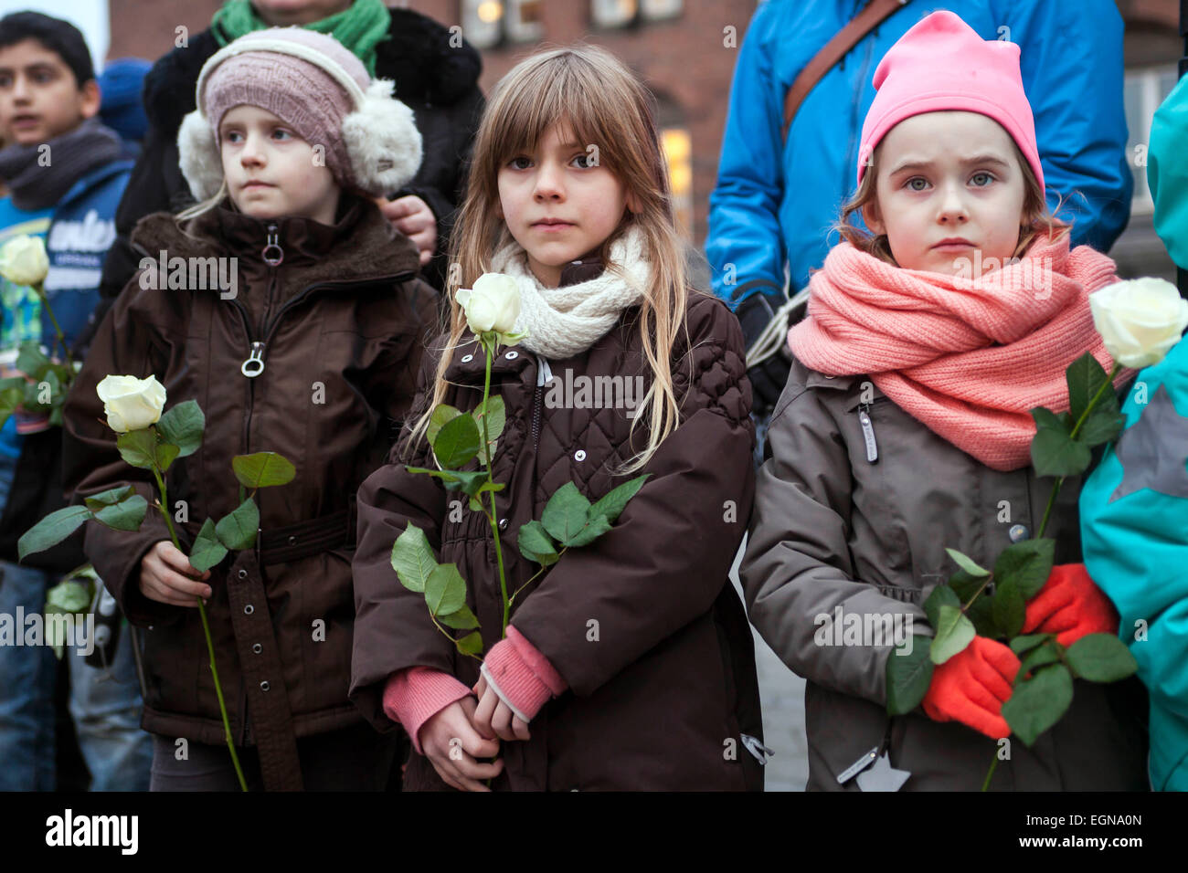 Copenhagen, Denmark. 27th February, 2015. Kids of all races and religions standing side by side holding white roses in this late Friday afternoon rally against hate crimes in Copenhagen. Credit:  OJPHOTOS/Alamy Live News Stock Photo