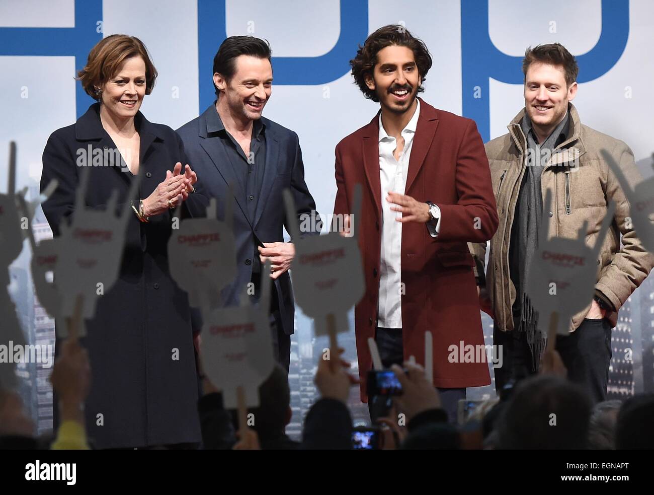 US actress Sigourney Weaver (l-r), Australian actor Hugh Jackman , British actor Dev Patel  and South African director Neill Blomkamp attend the fan event for their new film 'Chappie' in Berlin, Germany, 27 February 2015. The film starts in German cinemas on 5 March 2015. Photo:  Britta Pedersen/dpa Stock Photo