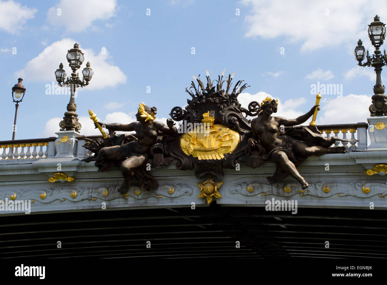 Nymphs of the Seine relief with arms of France on the ornate Pont Alexandre III bridge spanning the River Seine, Paris, France Stock Photo