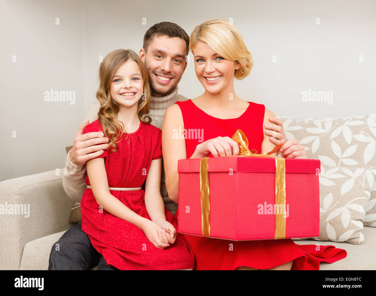 happy family opening gift box Stock Photo - Alamy