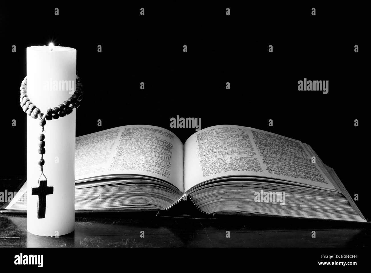 Bible, candle and the mystery of death Stock Photo