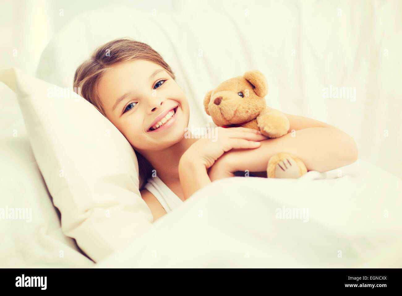little girl with teddy bear sleeping at home Stock Photo - Alamy